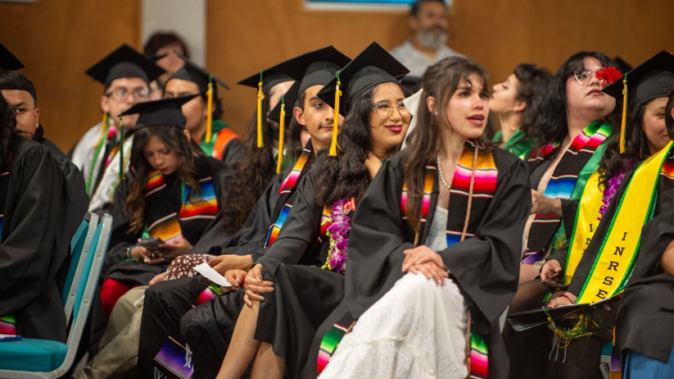 A group of graduates with El Centro grad sashes on. 