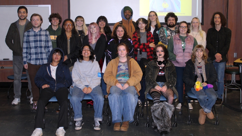 A group photo of film students sitting and standing in three rows.