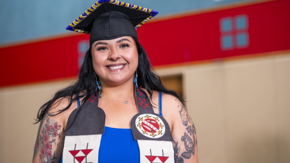A native grad with her ITEPP grad sash on. 