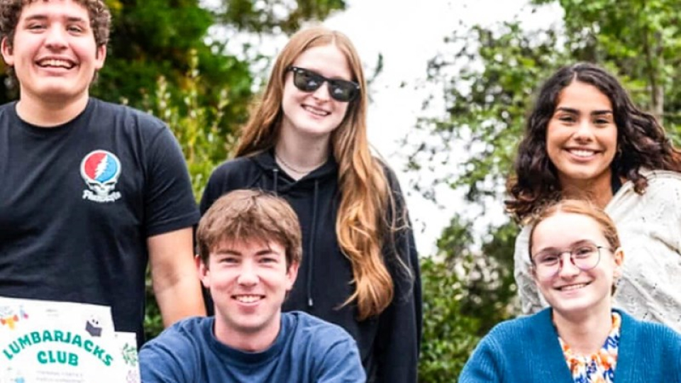 The smiling faces of 5 Humboldt Lumbarjacks Club members.