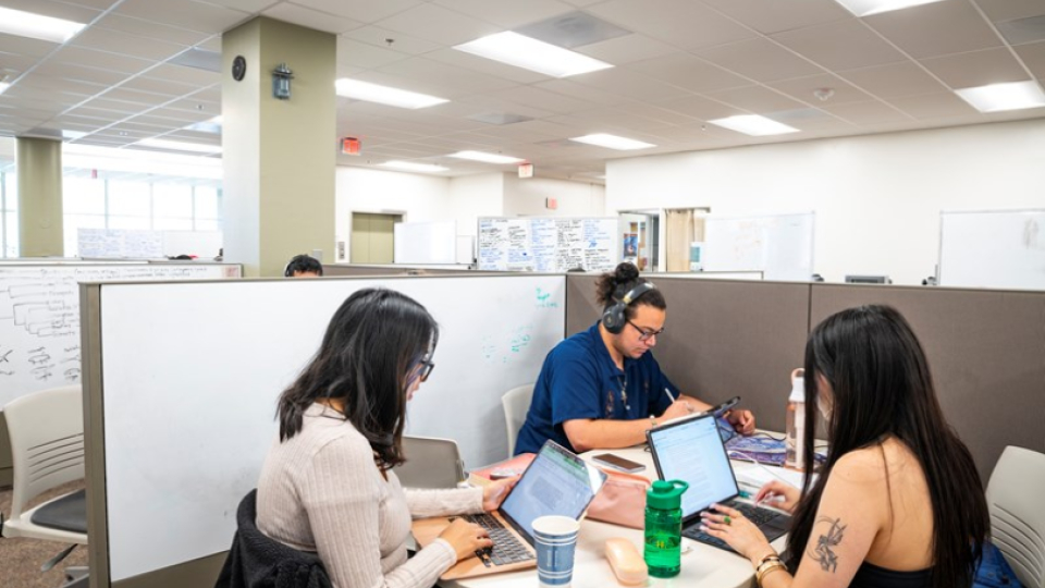 Three students studying in a student centered space in the Humboldt library.