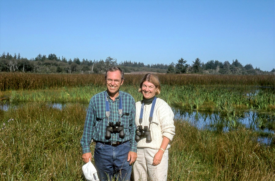 Don and Andrea Tuttle standing by a marsh