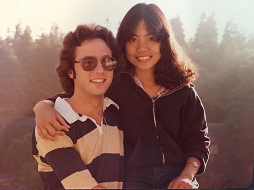 Eden Rubio Furgatch and Jacob Furgatch sit together amongst redwood trees at Cal Poly Humboldt.